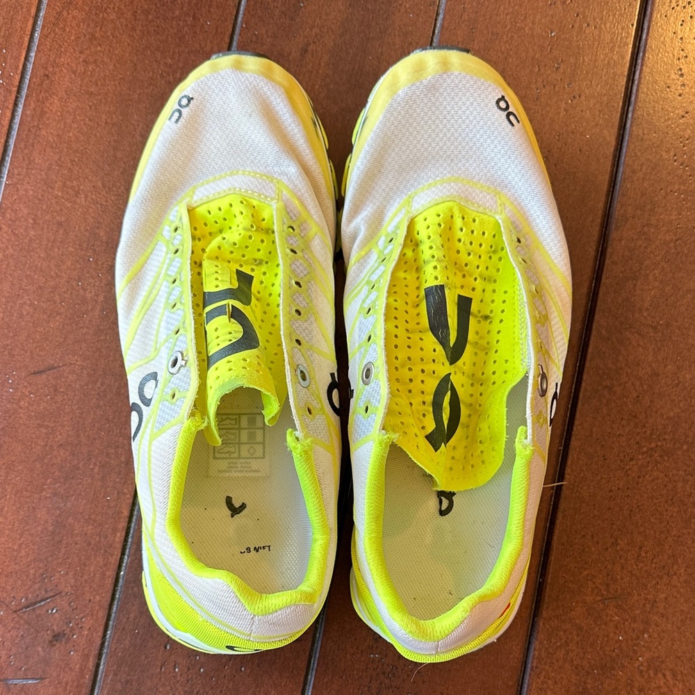 On Running White and Neon Yellow Slip-On Athletic Shoes